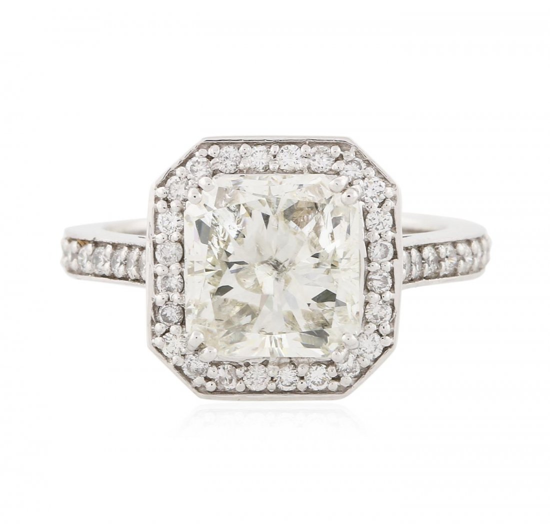 14KT White Gold 3.62 ctw I-1/M Diamond Ring: One electronically tested 14KT white gold ladies cast diamond unity ring with a bright polish finish. Condition is new, good workmanship. The featured diamond is set within a diamond lattice gallery,