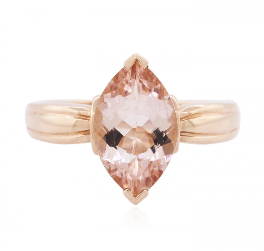 14KT Rose Gold 3.00 ctw Morganite Solitaire Ring: One solitaire ring featuring: 10KT rose gold weighing 3.90 grams containing one prong set marquise cut morganite with a total weight of 3.00ct.