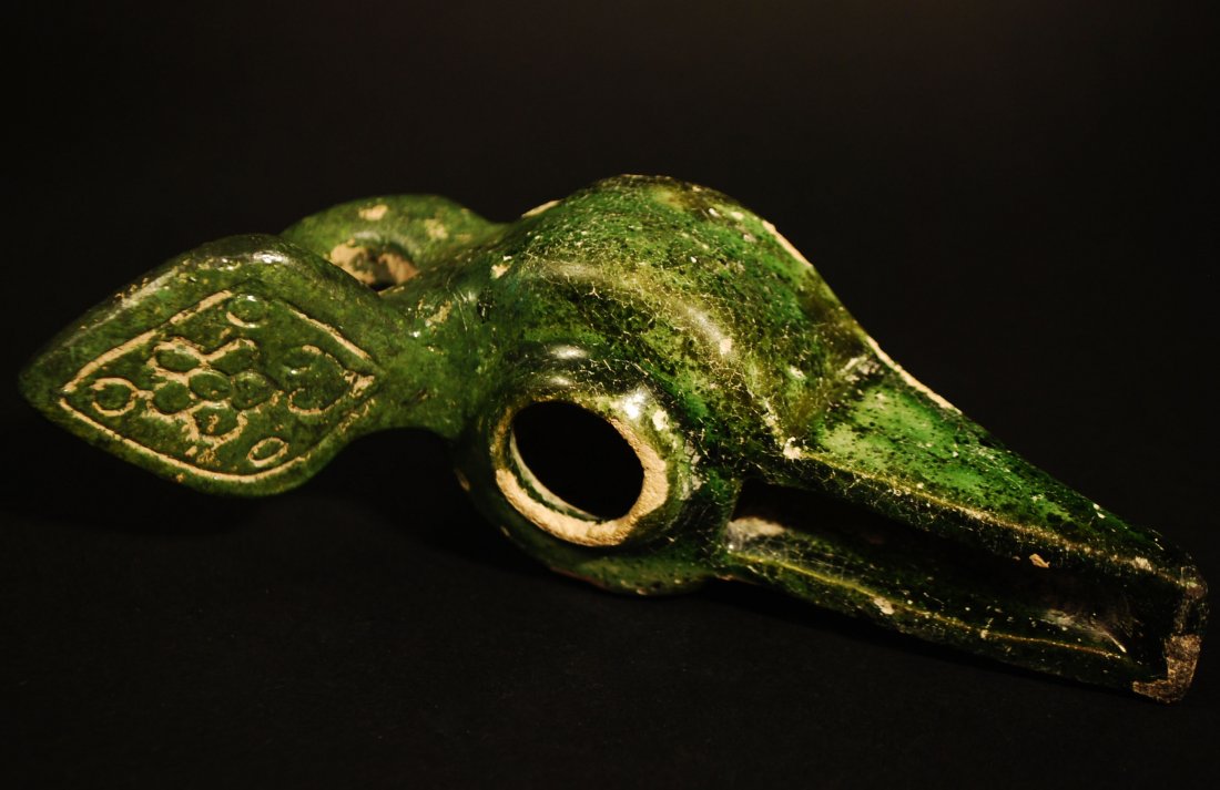 13th Century A.D. Antique Kashan Ceramic Green Oil Lamp: Unusual Ceramic Oil lamp with elaborate handle with floral design. Greenish glazed with long spout used for lighting. some paint chips otherwise perfect. Measurement: 6 inches. From a Private New York