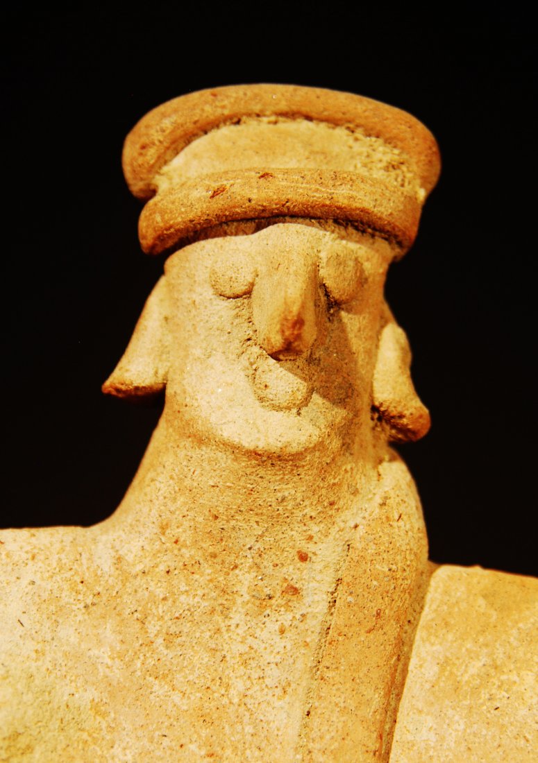 100 B.C. - 250 A.D. COLIMA FEMALE FLAT FIGURE: 100 B.C. - 250 A.D. FEMALE COLIMA FLAT FIGURE. A FEMALE FLAT FIGURE, WEARING A HEAD-WRAP THAT DRAPES AROUND HER SHOULDER TO HER CHEST. SOME SCATTERED MINERAL DEPOSITS, OTHERWISE INTACT. SIZE: HEIGHT- 