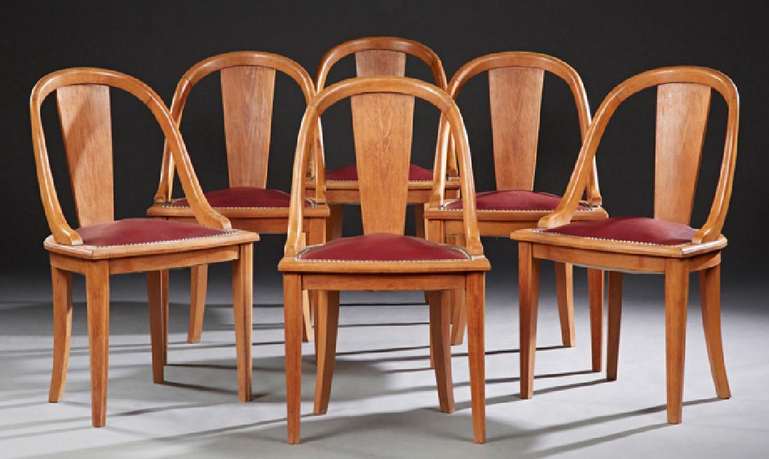 Set of Six French Carved Beech Bowfront Gondola Chairs,: Set of Six French Carved Beech Bowfront Gondola Chairs, 20th c., the arched curved backs with center splat to burgundy faux leather seats with iron tack decoration, on tapered reeded square legs, H.-