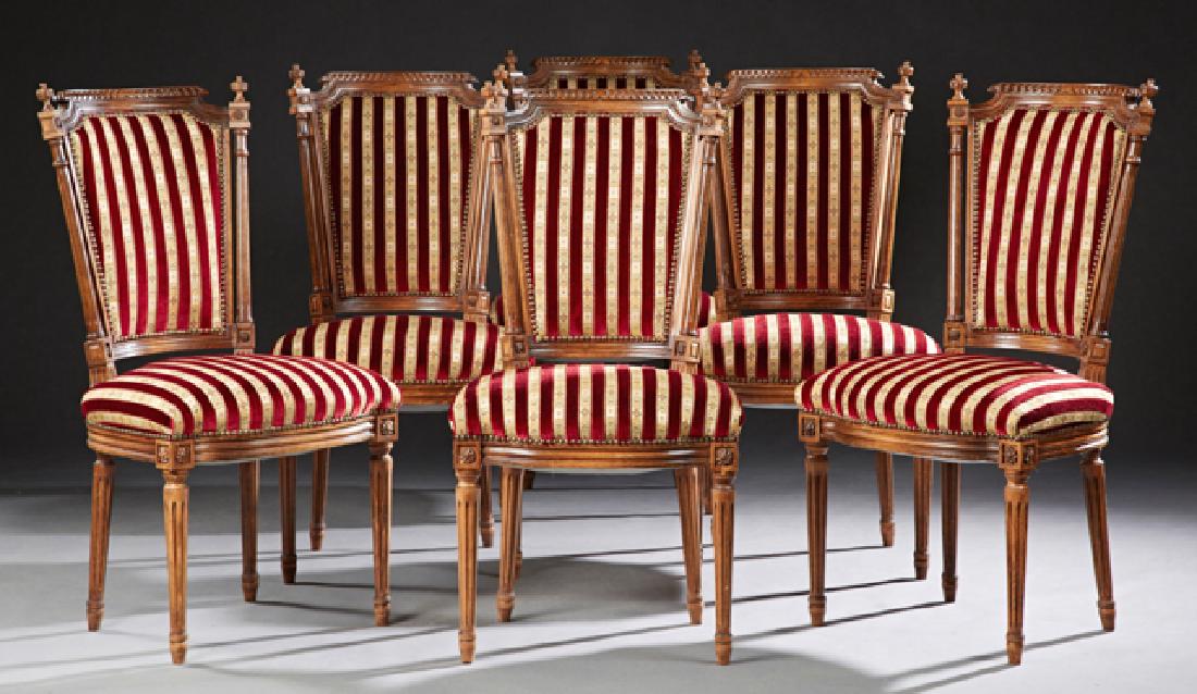 Set of Six French Carved Beech Louis XVI Style Dining: Set of Six French Carved Beech Louis XVI Style Dining Chairs, early 20th c., the curved upholstered backs over upholstered bowed seats, on reeded tapered legs, in striped velvet upholstery with steel 