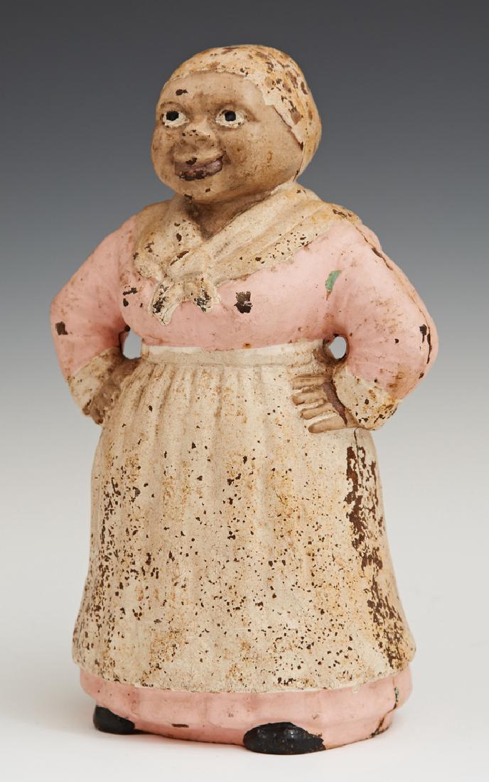 American Cast Iron Mammy Doorstop, 20th c., with: American Cast Iron Mammy Doorstop, 20th c., with original paint, H.- 9 in., W.- 5 1/2 in., D.- 3 1/4 in.