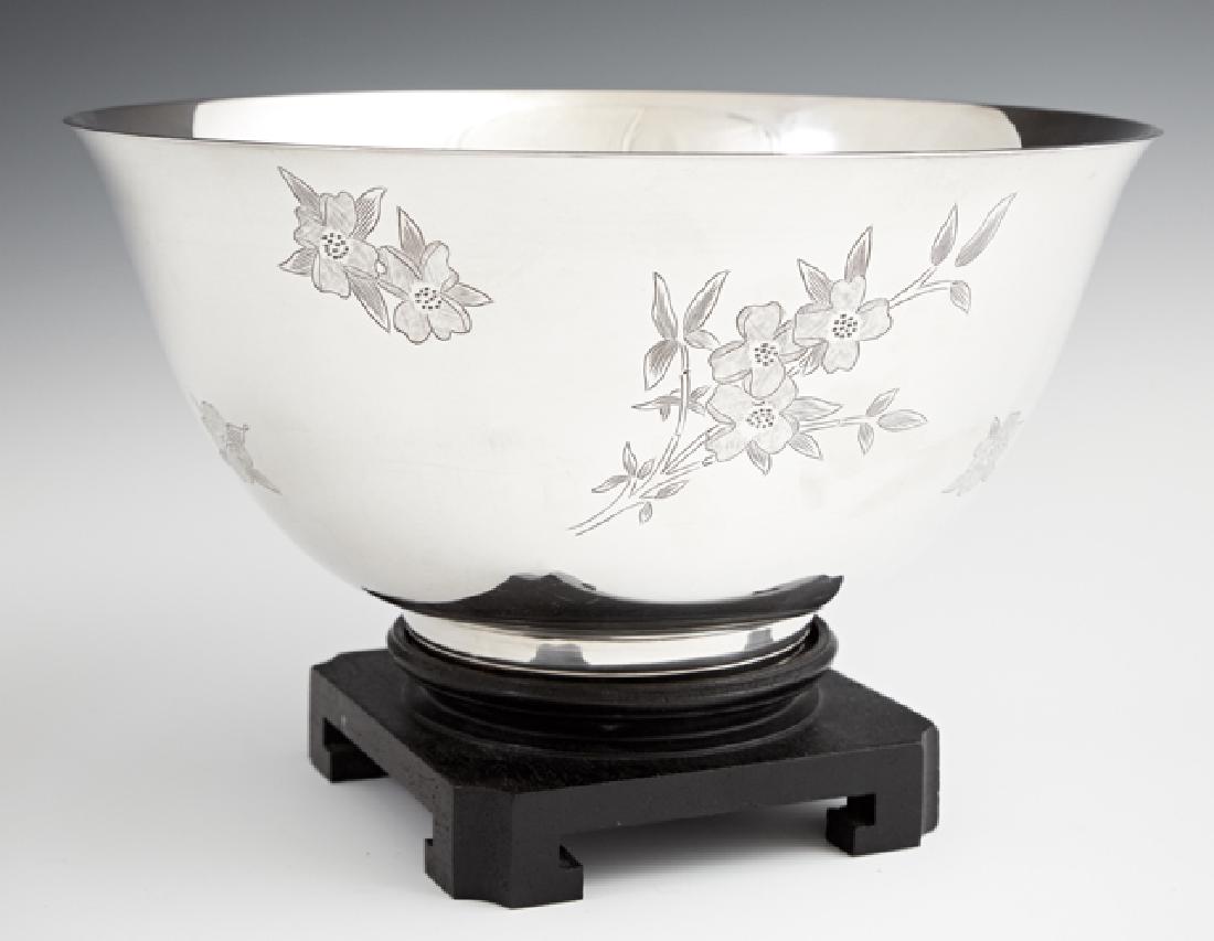 Sterling Bowl, 20th c., by S. Kirk and Son, in the: Sterling Bowl, 20th c., by S. Kirk and Son, in the "Dogwood" pattern, #120, the sides with engraved floral decoration, on a carved wooden stand, Wt.- 21.4 Troy Oz., H.- 4 in., Dia.- 8 1/8 in.