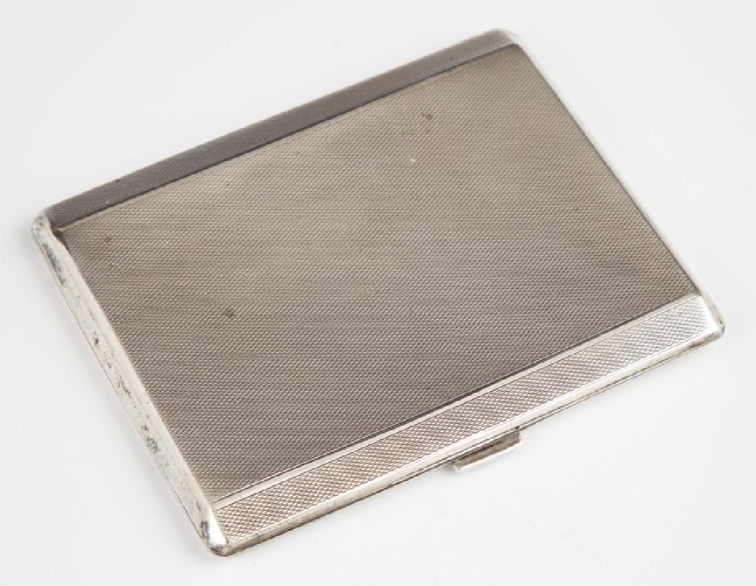 English Sterling Pocket Cigarette Case, Birmingham,: English Sterling Pocket Cigarette Case, Birmingham, 1932, by Charles Stuart Harris, with a gilt washed interior engraved Michael Service, H.- 4 1.4 in., W.- 3 1/2, D.- 1.4 in., Wt.- 4.75 Troy Oz.
