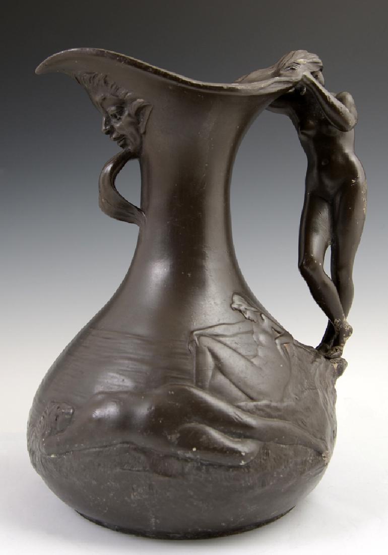 Charles T. Perron (1862-1934, French), Art Nouveau: Charles T. Perron (1862-1934, French), Art Nouveau Pewter Pitcher, early 19th c., with a figural nude handle and relief decorated of nude maids by water, impressed signature, H.- 9 3/4 in., W.- 7 1/4