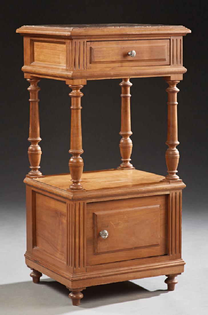 French Henri II Style Carved Walnut Marble Top: French Henri II Style Carved Walnut Marble Top Nightstand, late 19th c., the highly figured inset rouge marble over a frieze drawer on turned tapered supports to a cupboard door flanked by fluted stil