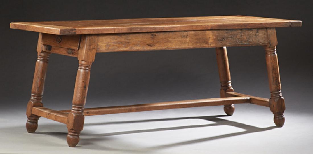 French Provincial Carved Oak Farmhouse Table, 19th c.,: French Provincial Carved Oak Farmhouse Table, 19th c., the thick top over a wide skirt with one end drawer on turned splayed trestle legs joined by a rectangular stretcher, H.- 29 1/4 in., W.- 73 3/4