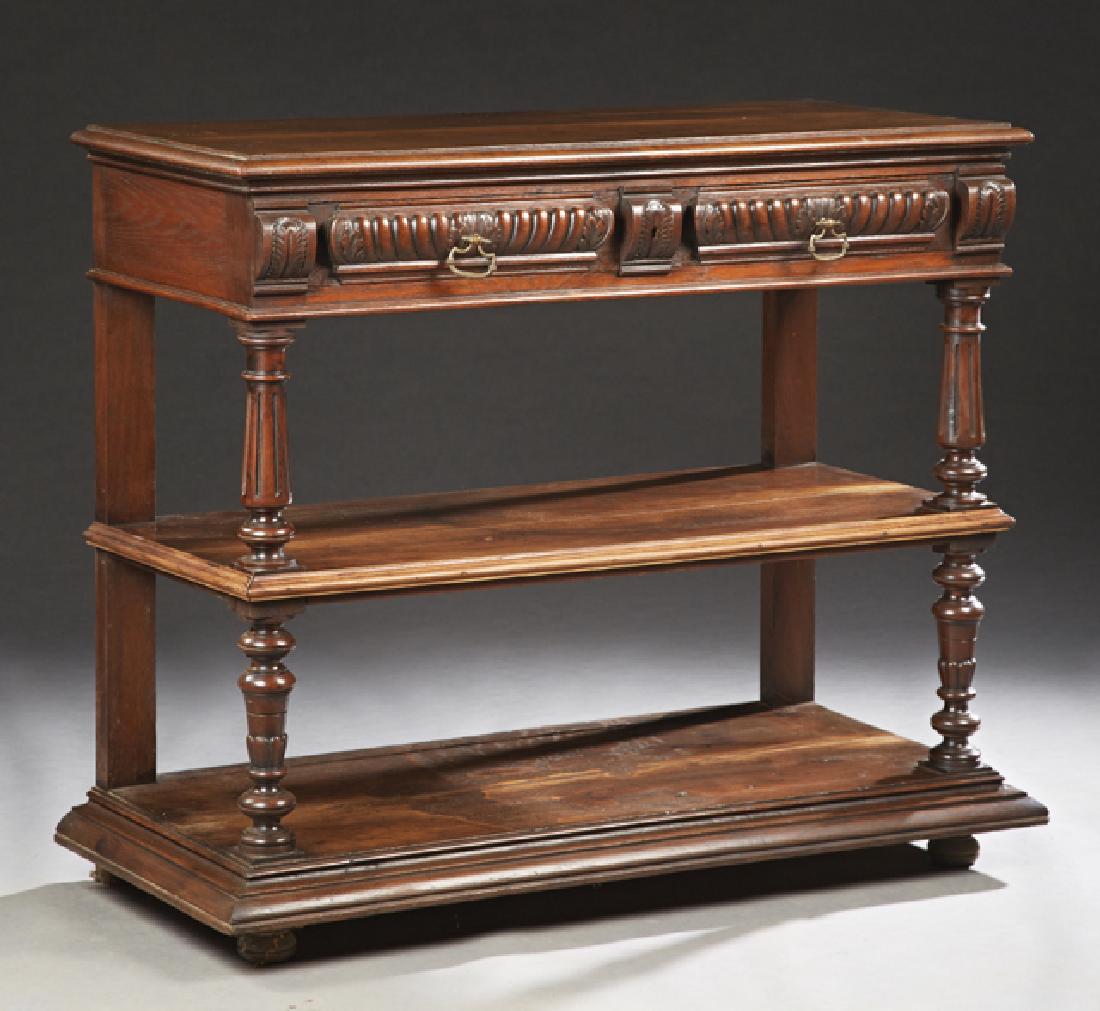French Henri II Style Carved Oak Serving Trolley, late: French Henri II Style Carved Oak Serving Trolley, late 19th c., the rectangular top over two frieze drawers on reeded tapered supports to a stepped central shelf, on like supports to a stepped sloping