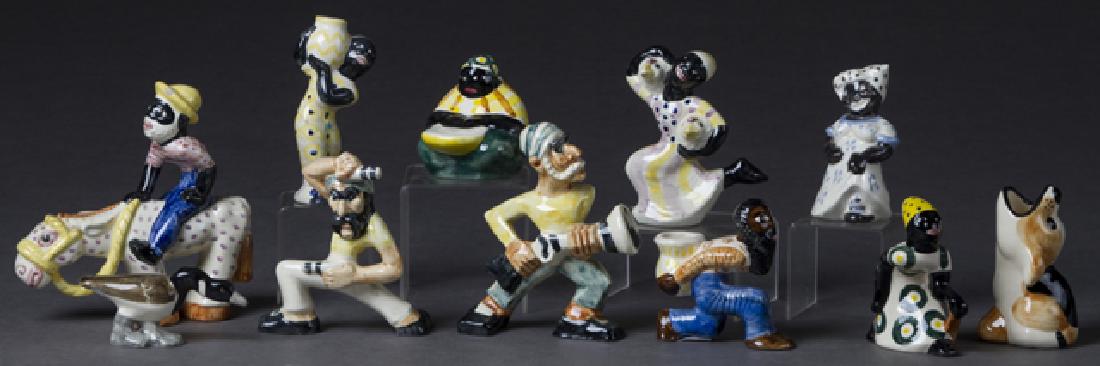 Group of Eleven Shearwater Pottery Figures, 20th c.,: Group of Eleven Shearwater Pottery Figures, 20th c., consisting of two pirates, a dog, a duck, a black kneeling woman, a seated mammy, a standing mammy, a black chicken thief, a black man carrying a j