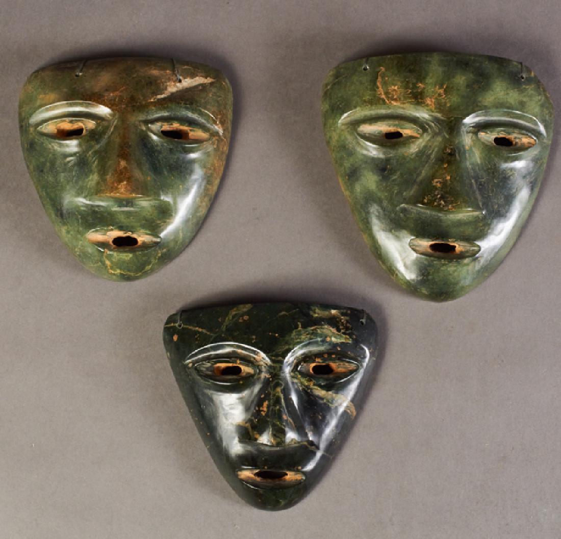 Group of Three Mexican Olmec Style Jade Masks, 20th c.,: Group of Three Mexican Olmec Style Jade Masks, 20th c., Largest- H.- 6 7/8 in., W.- 6 3/8 in., D.- 1 1/2 in.