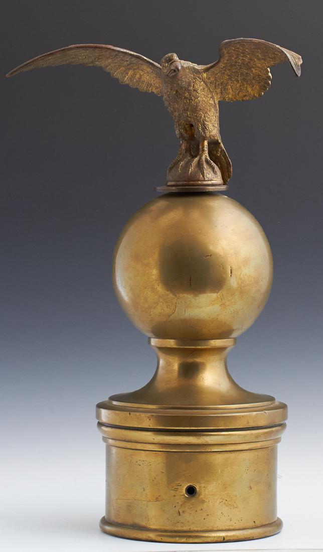 Large Brass Spread Eagle Newel Post, early 20th c., the: Large Brass Spread Eagle Newel Post, early 20th c., the eagle atop a large ball on a sloping cylindrical base, H.- 16 3/8 in., W.- 10 1/2 in., D.- 6 5/8 in. Provenance: The Sword & Pen Antiques, 528 R