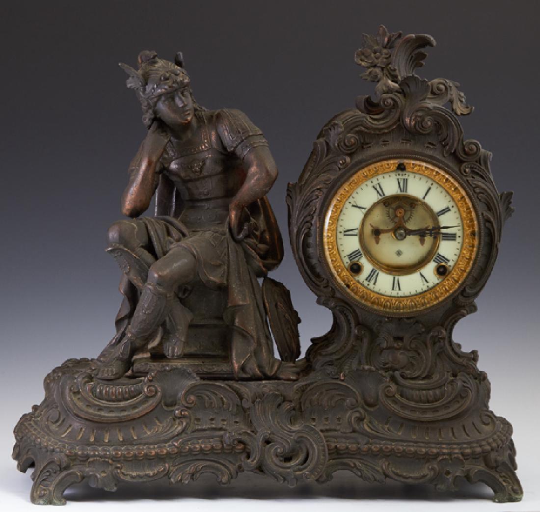 Ansonia Patinated Spelter Mantle Clock, early 20th c.,: Ansonia Patinated Spelter Mantle Clock, early 20th c., with a seated Roman soldier wearing a winged hat, cape and shin guards, next to an open escapement drum clock, time and strike, on a relief scrol