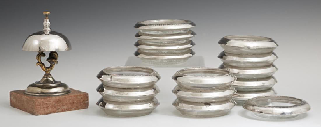Group of Sixteen Sterling Rim Glass Coasters, by: Group of Sixteen Sterling Rim Glass Coasters, by various makers, together with a silverplated counter bell on a marble base. (17 Pcs.)