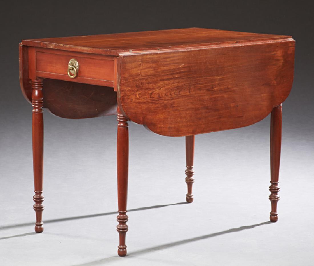 English Carved Cherry Drop Leaf Table, 19th c., the: English Carved Cherry Drop Leaf Table, 19th c., the serpentine top over an end drawer, on ring turned tapered legs with ball feet, H.- 28 3/4 in., W.- 35 3/4 in., D.- 22 1/4 in., Open D.- 45 1/4 in.