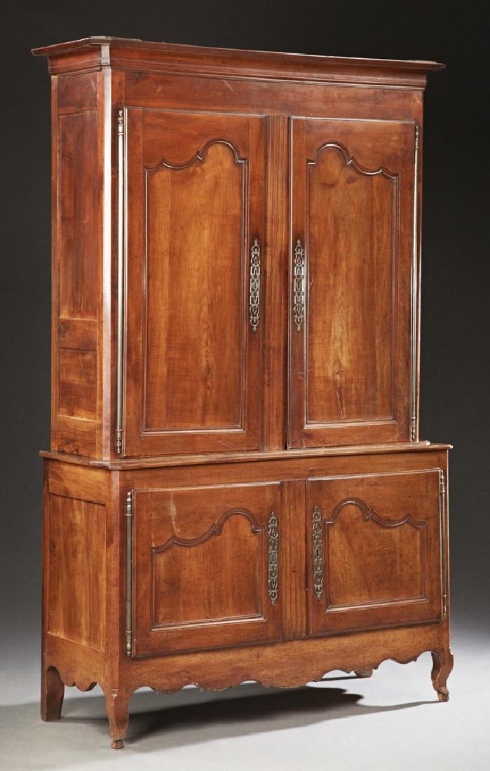 French Louis XV Style Carved Cherry Buffet a Deux: French Louis XV Style Carved Cherry Buffet a Deux Corps, mid 19th c., the canted corner crown over double doors with steel escutcheons and long fiche hinges, on a base with double cupboard doors with 