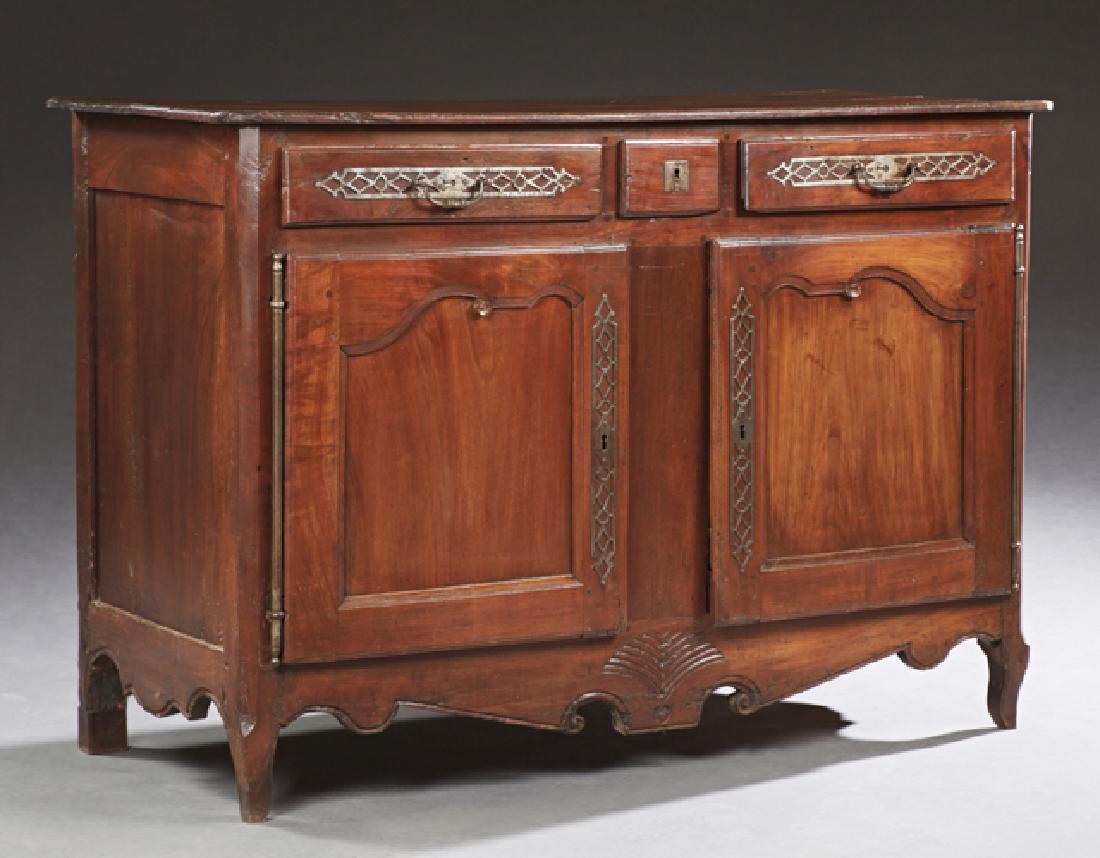 French Louis XV Style Carved Oak Sideboard, 19th c.,: French Louis XV Style Carved Oak Sideboard, 19th c., the rounded corner top over a central short drawer flanked by two drawers above double cupboard doors with iron escutcheons and long fiche hinges, 