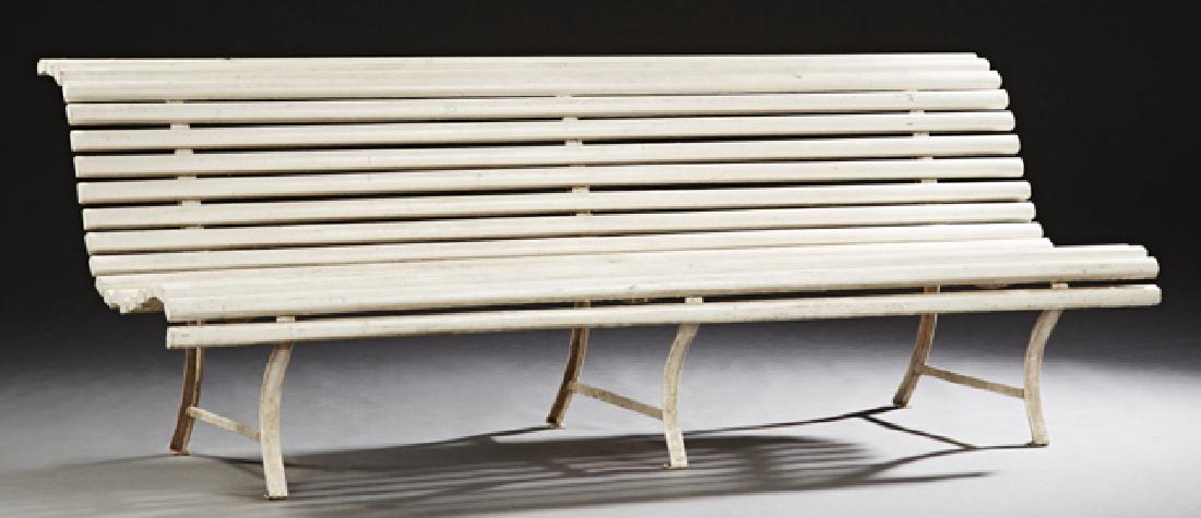 French Cast Iron and Beech Garden Bench, 20th c., the: French Cast Iron and Beech Garden Bench, 20th c., the curved slatted back and seat on splayed legs, H.- 29 1/2 in., W.- 82 3/4 in., D.- 32 in.
