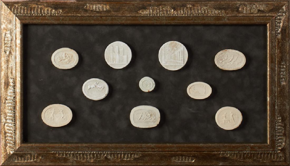 Group of Ten Plaster Intaglios, 19th c., Grand Tour: Group of Ten Plaster Intaglios, 19th c., Grand Tour Souvenirs, presented in a silvered gray velvet shadowbox frame, H.- 7 1/2 in., W.- 15 1/2 in.