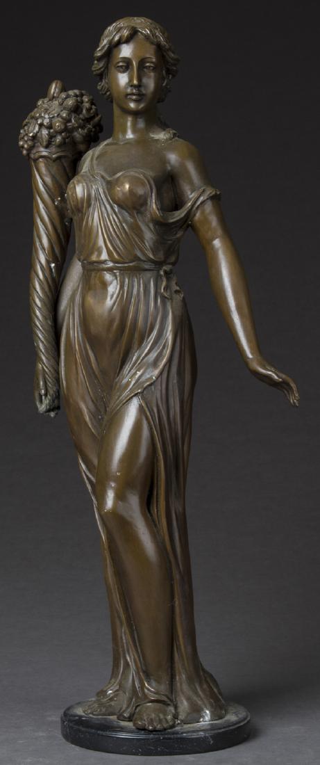 Large Art Nouveau Patinated Bronze Figure, c.: Large Art Nouveau Patinated Bronze Figure, c. 1920, of a classical woman holding a horn of plenty with fruit and flowers, on a circular black marble base, H.- 34 1/2 in., W.- 15 in., D.- 9 in. Provena