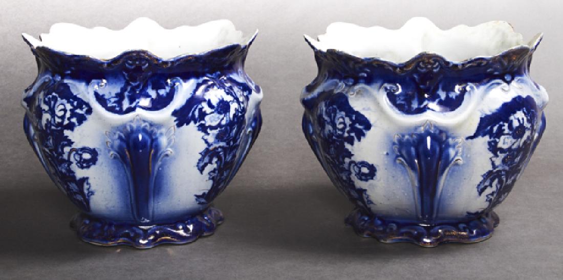 Pair of Ironstone Jardinieres, 20th c., of: Pair of Ironstone Jardinieres, 20th c., of baluster form with gilt and blue floral decoration, H.- 8 1/4 in., Dia.- 10 in.