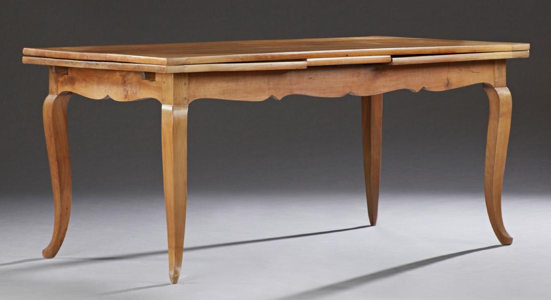French Provincial Carved Cherry Draw Leaf Dining: French Provincial Carved Cherry Draw Leaf Dining Table, early 20th c., the rectangular top over a scalloped skirt, on tapered square cabriole legs, H.- 30 in., W. Open- 122 in., W. Closed- 67 in., D.-