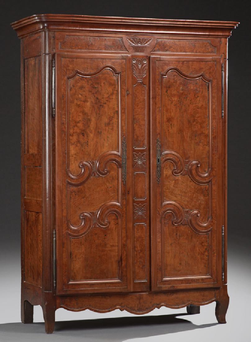 French Provinvial Carved Walnut Armoire, 19th c.,: French Provincial Carved Walnut Armoire, 19th c., the stepped ogee crown over double three panel doors with long steel fiche hinges and long steel escutcheons, separated by a fielded panel pilaster, o