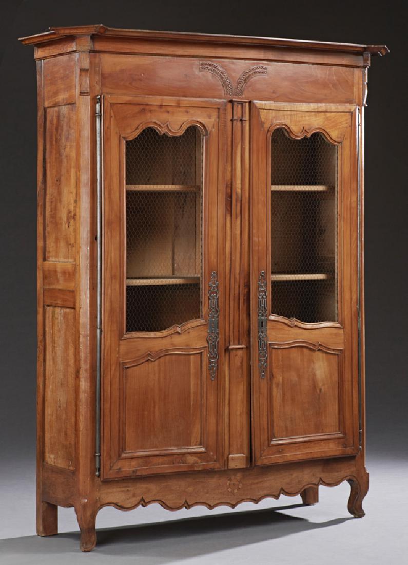 French Louis XV Style Carved Inlaid Cherry: French Louis XV Style Carved Inlaid Cherry Bibliotheque, mid 19th c., the stepped canted corner crown, over double doors, the upper panels with wire, with long steel escutcheons and fiche hinges, sepa