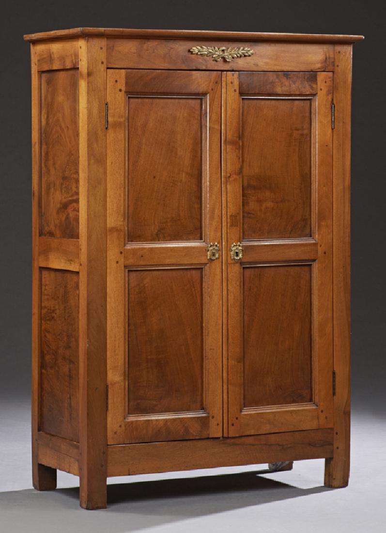 French Ormolu Mounted Carved Cherry Cupboard,: French Ormolu Mounted Carved Cherry Cupboard, early 20th c., the rounded corner crown over double two paneled doors, on block feet, the interior with shelves, H.- 59 3/4 in., W.- 41 3/4 in., D.- 17 in