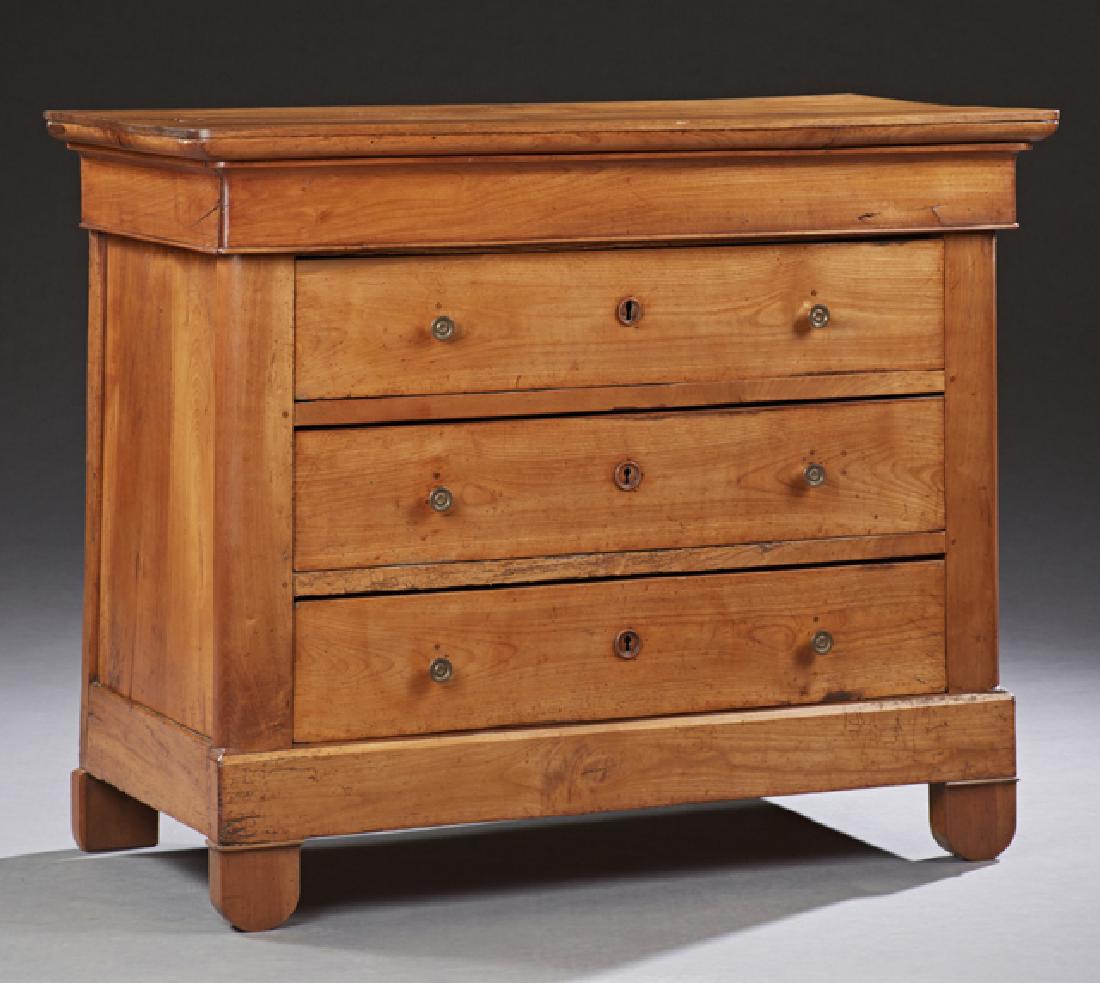 Louis Philippe Style Carved Cherry Commode, 19th: Louis Philippe Style Carved Cherry Commode, 19th c., the rounded corner rectangular top above a cavetto frieze drawer and three deep drawers on a plinth base, with bun feet, H.- 35 1/2 in., W.- 44 1/8