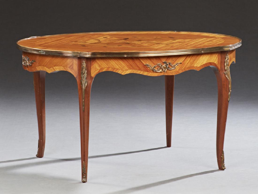 French Ormolu Mounted Marquetry Inlaid Kingwood: French Ormolu Mounted Marquetry Inlaid Kingwood Coffee Table, early 20th c., the brass banded tortoise top over a serpentine skirt on cabriole legs with omolu sabots, H.- 20 1/2 in., W.- 38 in., D.- 2