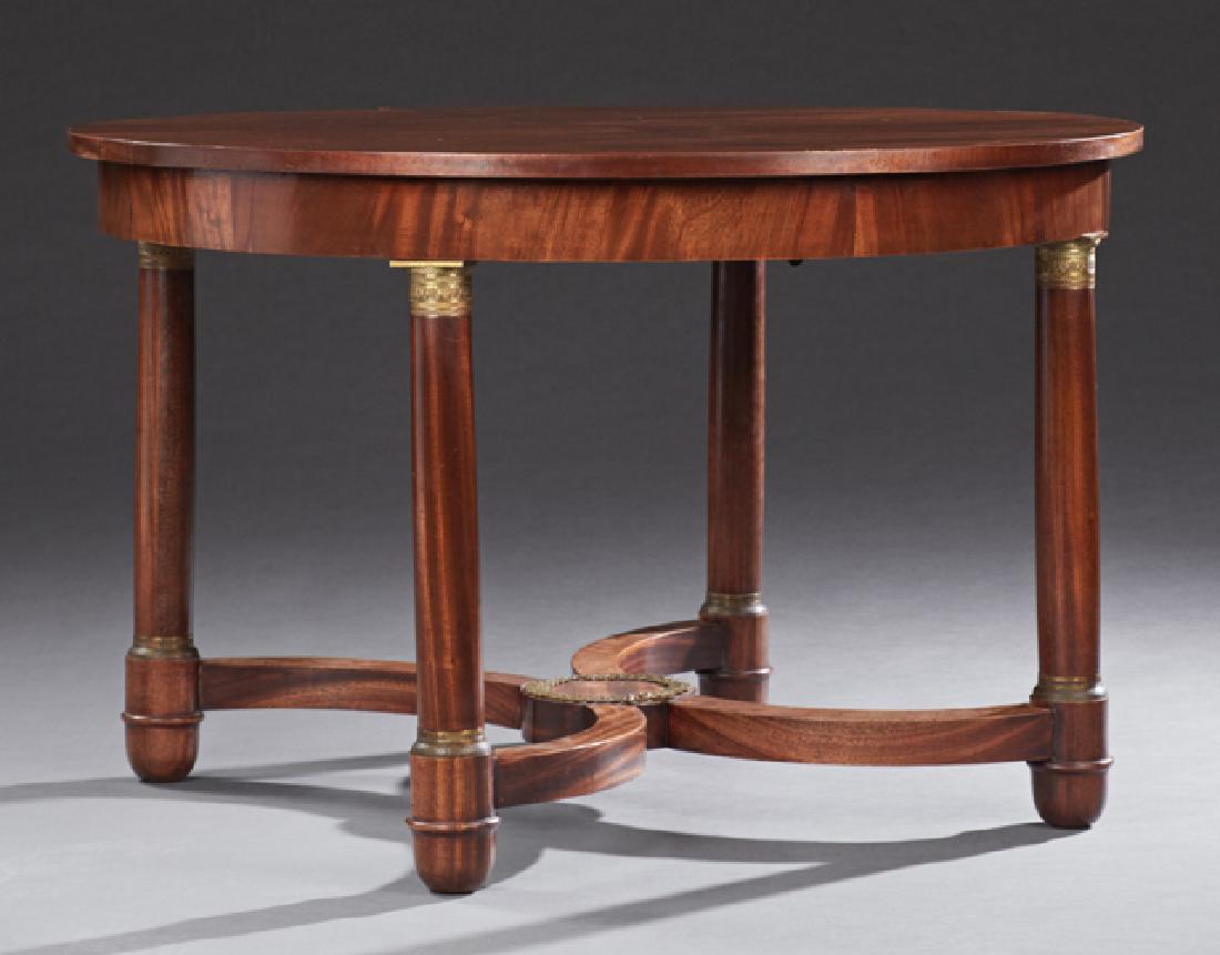 French Empire Style Ormolu Mounted Dining Table,: French Empire Style Ormolu Mounted Dining Table, 20th c., the circular top over a wide skirt, on four ormolu mounted cylindrical legs with rounded feet, joined by an X-form stretcher, H.- 30 3/4 in.,