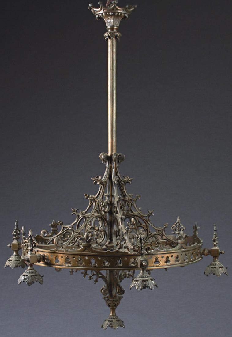 French Bronze Gothic Style Seven Light Chandelier,: French Bronze Gothic Style Seven Light Chandelier, 19th c., the crown form canopy issuing a central reeded shaft with pierced trefoil supports for the six lights, issuing from a flat ring with fleur-d
