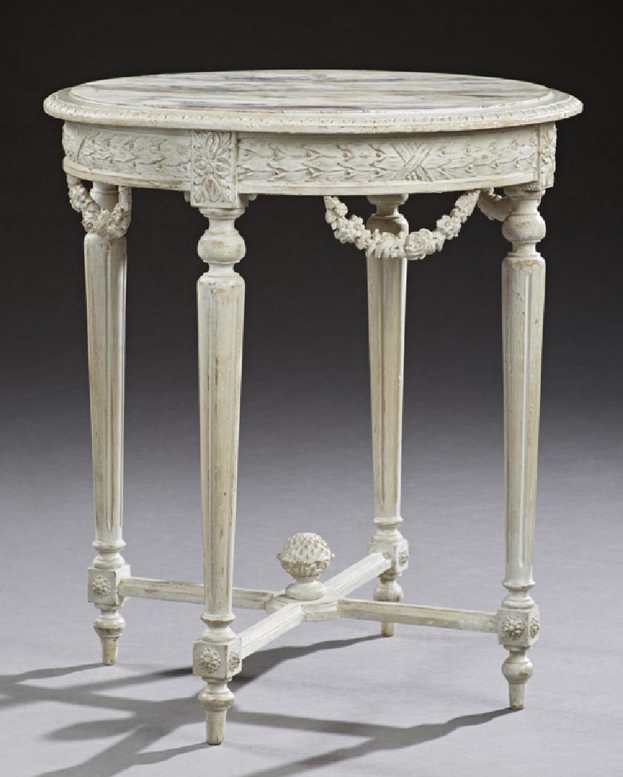 French Louis XVI Style Marble Top Polychrome Circular: French Louis XVI Style Marble Top Polychrome Circular Center Table, 19th c., the inset highly figured white marble over the carved skirt with rosette swags, on tapered fluted legs and toupie feet join
