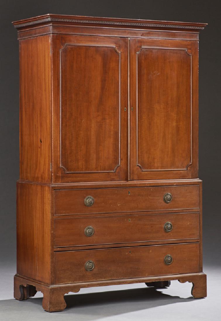 English Georgian Carved Mahogany Linen Press, early: English Georgian Carved Mahogany Linen Press, early 19th c., the stepped dentillated crown over double cupboard doors open to slides, on a base with three long deep drawers raised on a plinth base on 