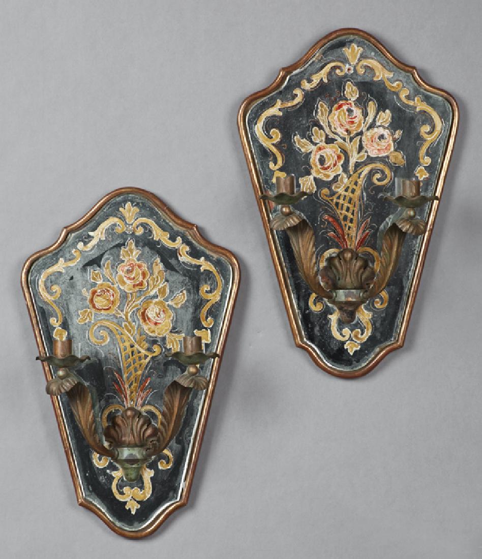 Pair of Antique French Two Light Candle Sconces, mid: Pair of Antique French Two Light Candle Sconces, mid 19th c., of tapered form, the mirror backs with eglomise decoration of roses atop giltwood framework, the tole candlearms of leaf form with floral 