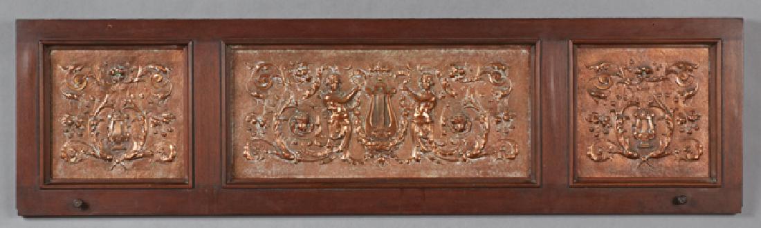 Unusual Copper Relief Upright Piano Door Panel, early: Unusual Copper Relief Upright Piano Door Panel, early 20th c., with three relief panels, the sides with relief lyres and flowers, the center with relief classical maidens flanking a lyre, within a mah