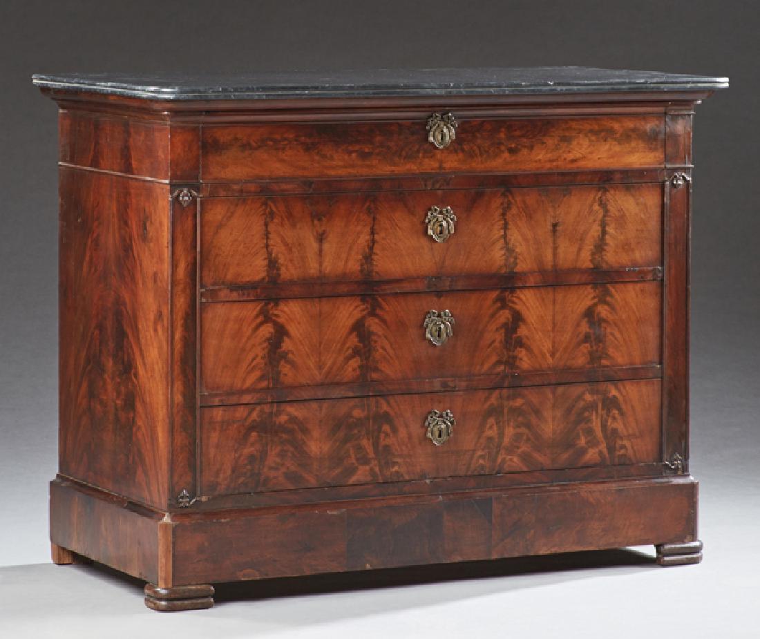 French Louis Philippe Carved Walnut Marble Top Commode,: French Louis Philippe Carved Walnut Marble Top Commode, 19th c., the rounded corner reeded edge figured black marble over a frieze drawer and three deep drawers, on rounded block feet, H.- 37 in., W.-