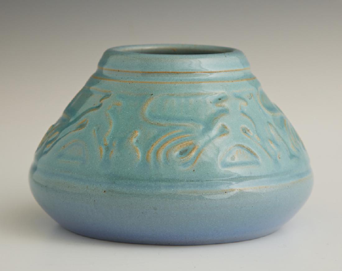 Julia Mattson, "Rodeo Riders," early 20th c., turquoise: Julia Mattson, "Rodeo Riders," early 20th c., turquoise glazed relief pottery vase, University of North Dakota School of Mines, Grand Forks, ND, the bottom with a blue stamp and an incised artist's si