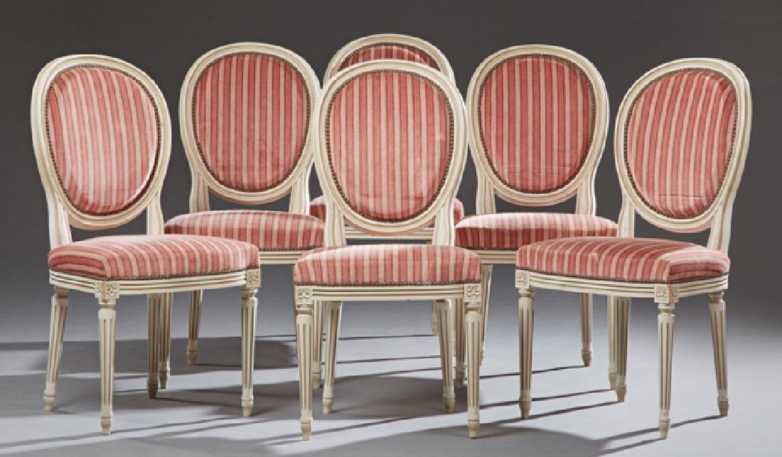 Set of Six French Polychromed Beech Louis XVI Style: Set of Six French Polychromed Beech Louis XVI Style Dining Chairs, 20th c., the oval medallion back over a bowed seat, on turned tapered reeded legs with toupie feet, in pink striped upholstery with b