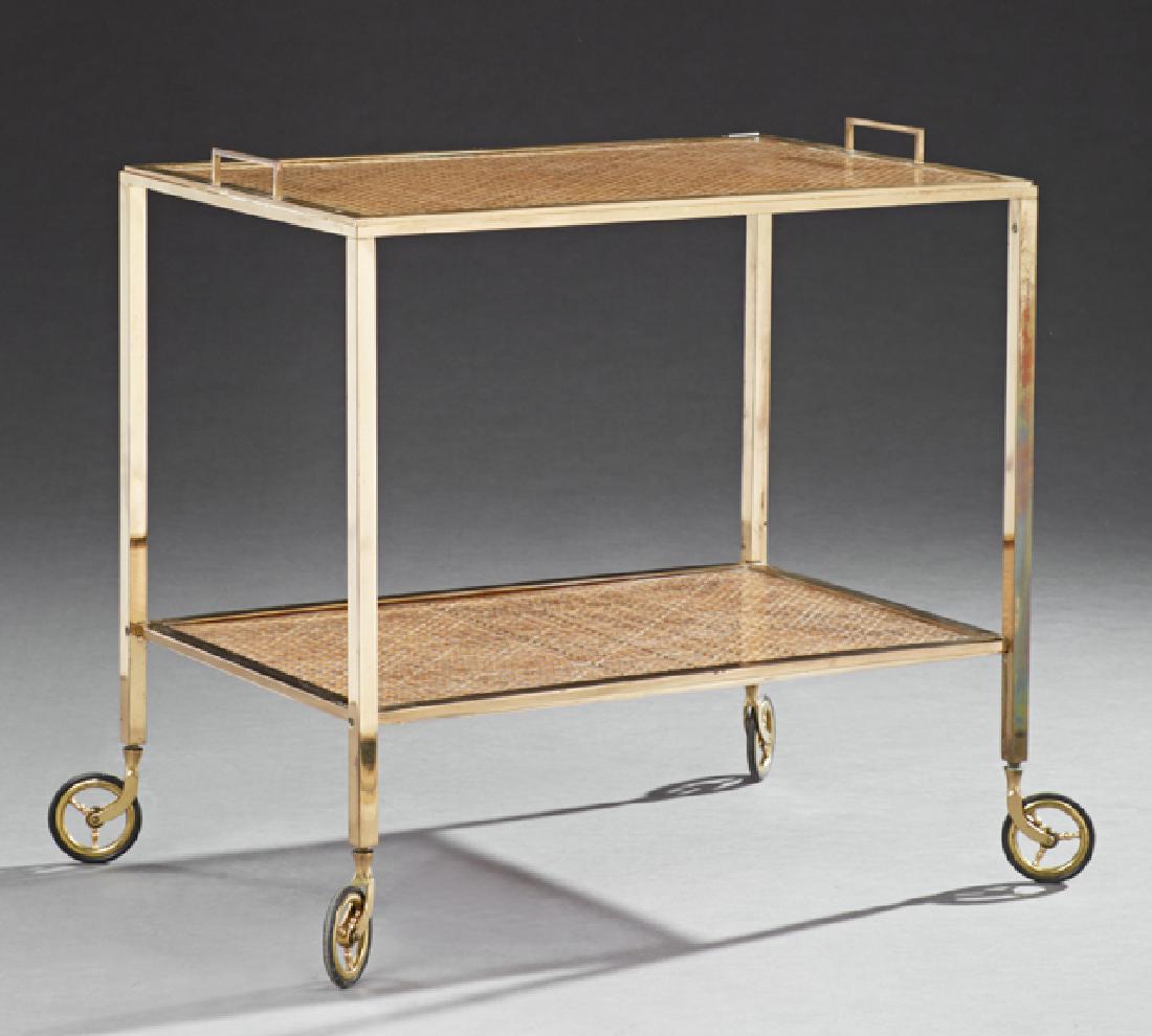 Modern Brass Dessert Cart, 20th c., the rectangular top: Modern Brass Dessert Cart, 20th c., the rectangular top with brass banding around a caned plexi glass covered surface over a like lower shelf, on wheels, H.- 24 1/2 in., W.- 26 3/8 in., D.- 17 3/8 in.