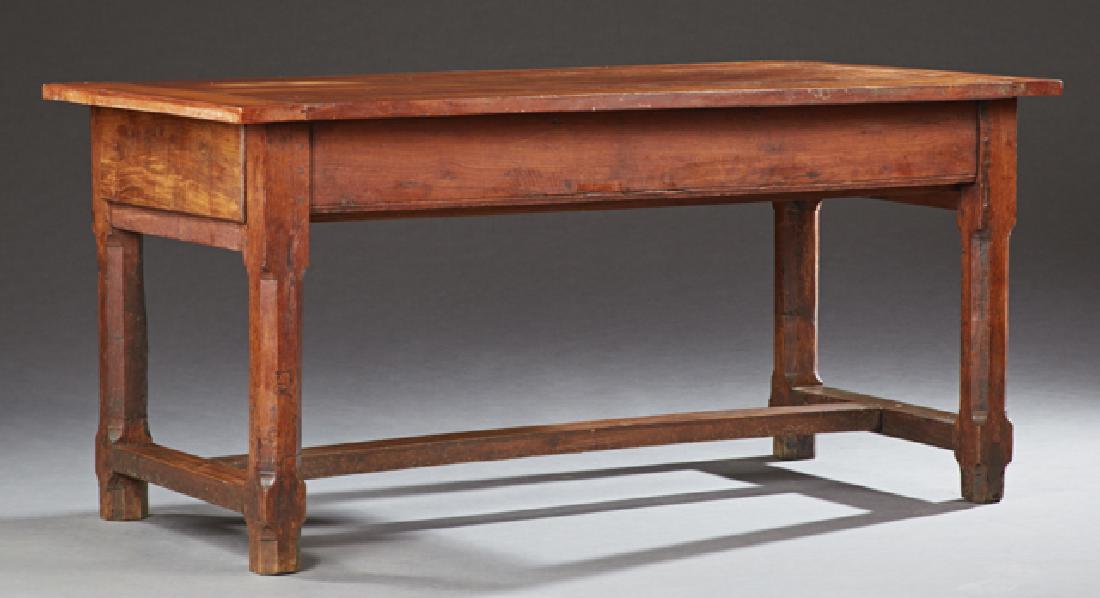 French Provincial Carved Cherry Farmhouse Table, the: French Provincial Carved Cherry Farmhouse Table, the rectangular top over a wide skirt with one end drawer, on chamfered legs joined by a rectangular H-form stretcher, H.- 28 1/2 in., W.- 61 3/8 in.,