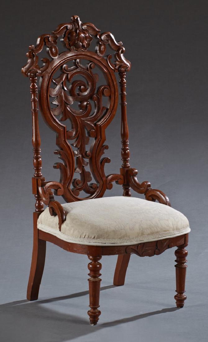 American Rococo Revival Slipper Chair, c. 1875, with a: American Rococo Revival Slipper Chair, c. 1875, with a fruit carved pierced crest over a pierced back within turned supports, to a bowed upholstered seat on turned legs, H.- 41 in., W.- 18 in., D.- 18