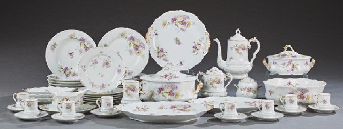 One Hundred Seven Piece Set of French Limoges Porcelain: One Hundred Seven Piece Set of French Limoges Porcelain Dinnerware, early 20th c., with lavender and green floral decoration, consisting of 12 soup bowls, 11 salad plates, 70 dinner plates, 2 covered 