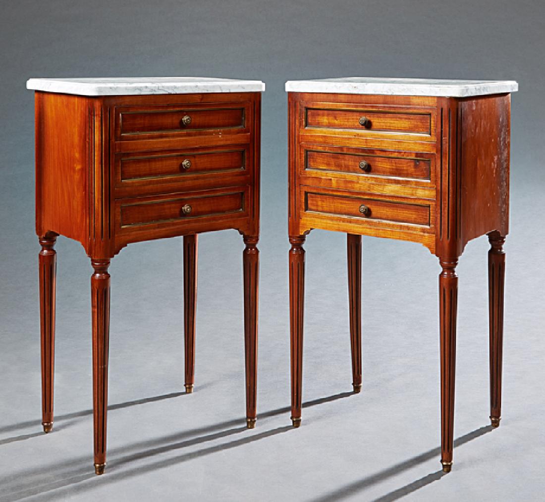 Pair of Louis XVI Style Carved Cherry Marble Top: Pair of Louis XVI Style Carved Cherry Marble Top Nightstands, 20th c., the figured ogee edge white marble over three shadow drawers flanked by reeded rounded pilaster sides, on reeded tapered legs wit
