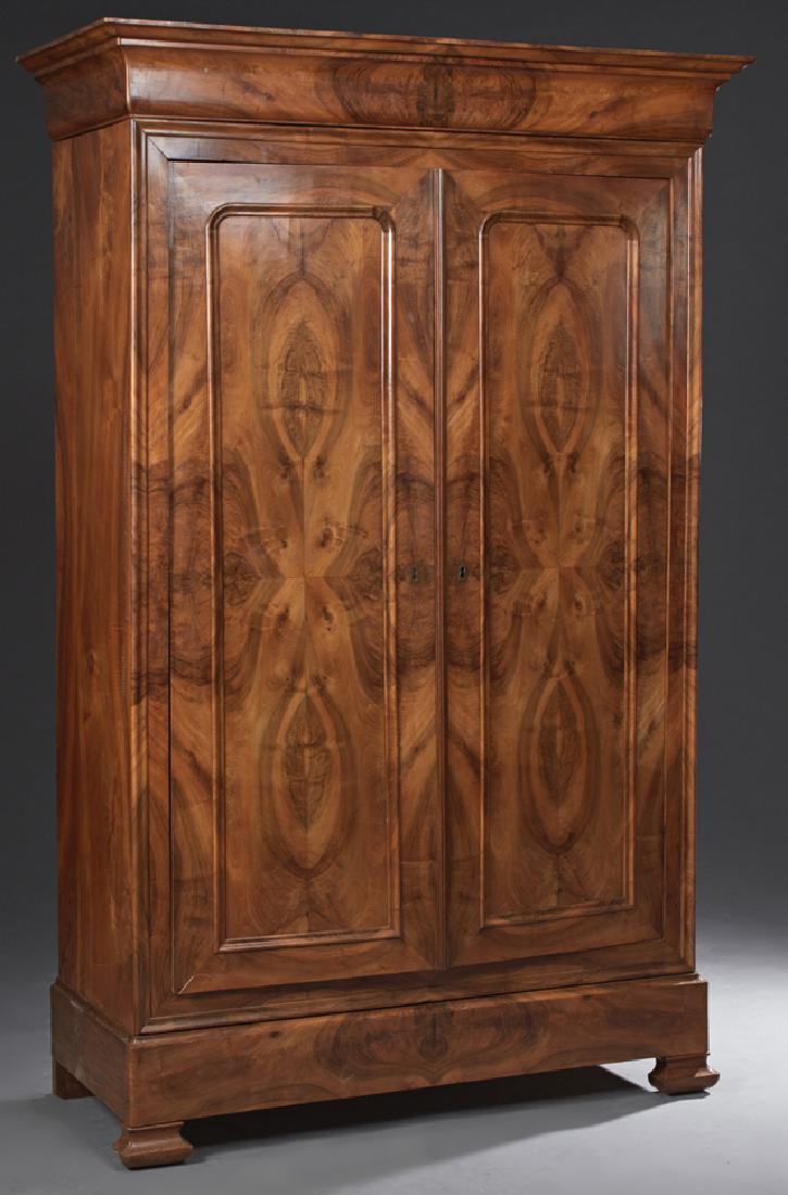 French Louis Philippe Carved Walnut Armoire, c. 1860,: French Louis Philippe Carved Walnut Armoire, c. 1860, the stepped cavetto crown over two fielded panel doors with a 'secret' drawer, on a plinth base and stepped ogee block feet, H.- 89 in., W.- 60 in
