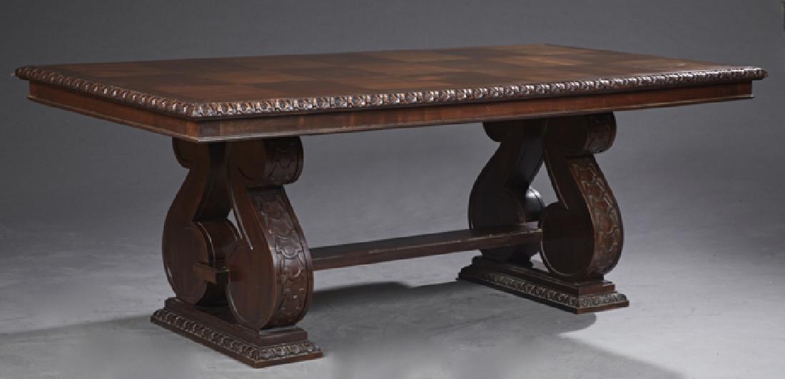 French Carved Cherry Refectory Table, c. 1900, the: French Carved Cherry Refectory Table, c. 1900, the carved edge parquetry inlaid top on large scrolled trestle form supports, on stepped relief carved rectangular pilasters, joined by a large square st