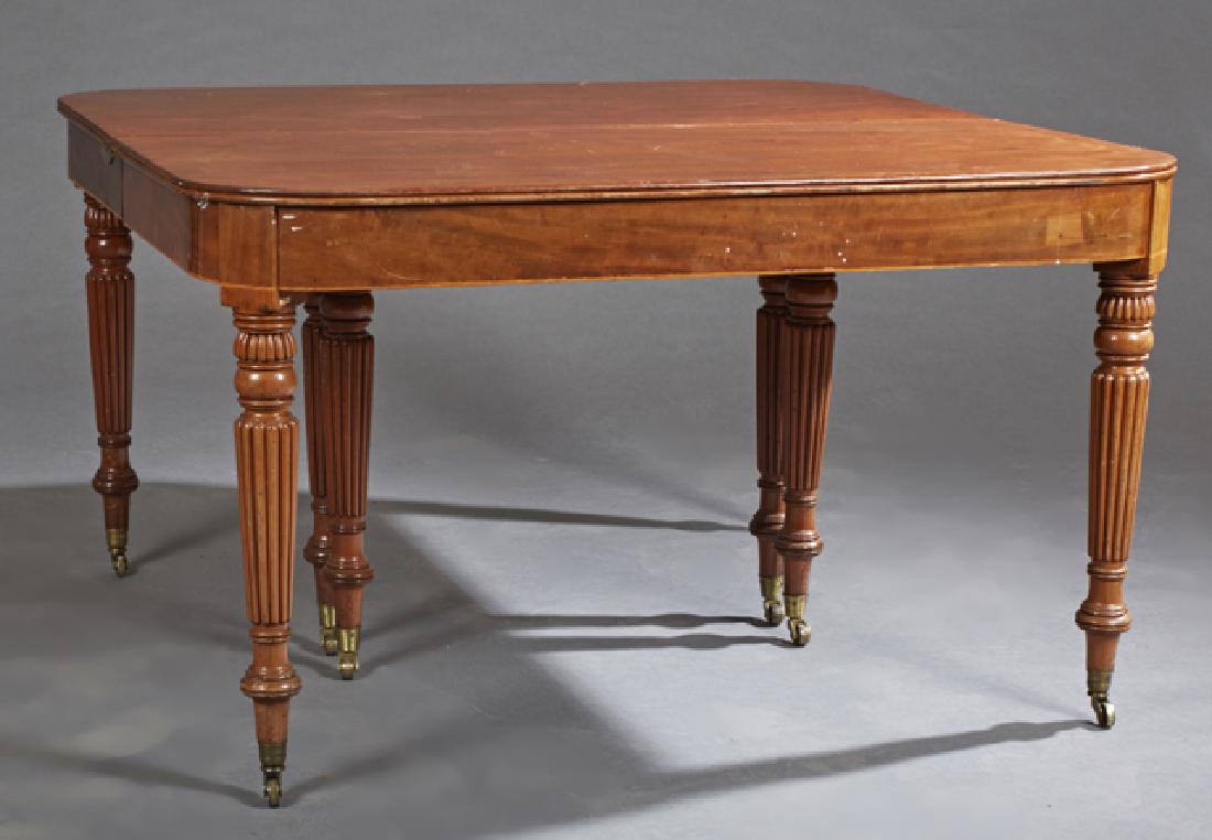 English William IV Carved Mahogany Dining Table, c.: English William IV Carved Mahogany Dining Table, c. 1850, the reeded edge rounded corner top over a wide skirt, on turned reeded tapered legs on casters, with three leaves, Table- H.- 28 1/2 in., Clos