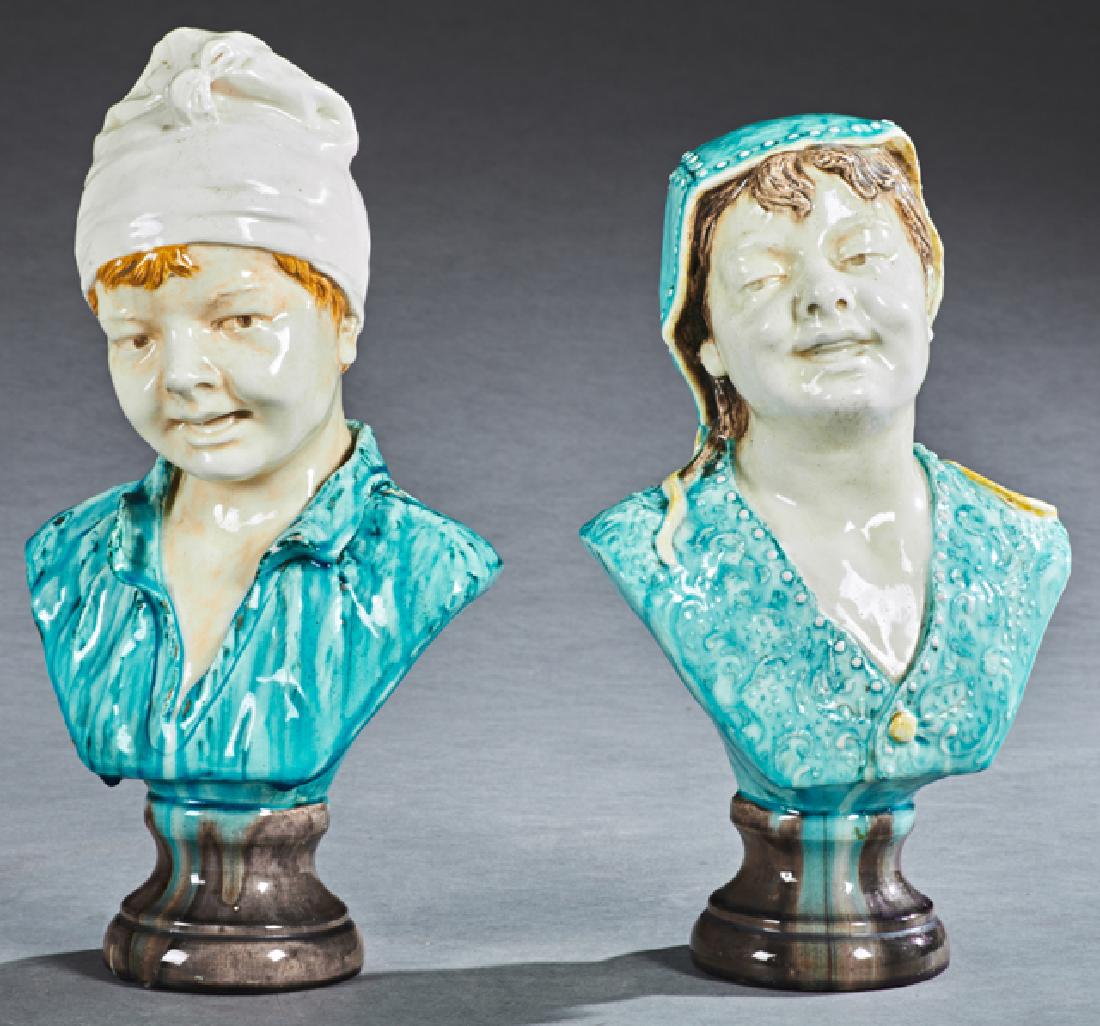 George Jones (1823-1893, English), "Peasant Boy," and: George Jones (1823-1893, English), "Peasant Boy," and "Peasant Girl," 19th c., pair of Majolica busts, impressed "222," and "GJ" on the integral stands, H.- 17 1/2 in., W.- 9 1/2 in., D.- 6 1/4 in.
