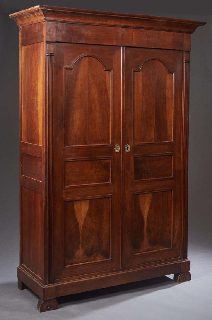 French Provincial Louis Philippe Style Carved Walnut: French Provincial Louis Philippe Style Carved Walnut Armoire, 19th c., the stepped ogee crown over two triple paneled doors, flanked by fluted pilasters, on a plinth base on demilune feet, H.- 95 in.,